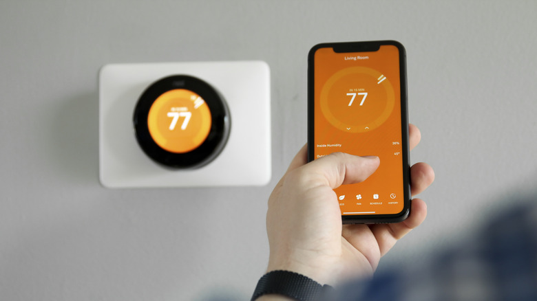 Using a mobile phone to control the temperature of a thermostat