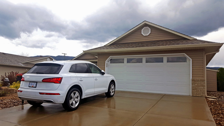 A car in front of a garage