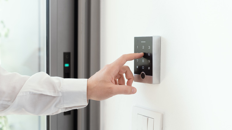 A person writing the code for the smart security system