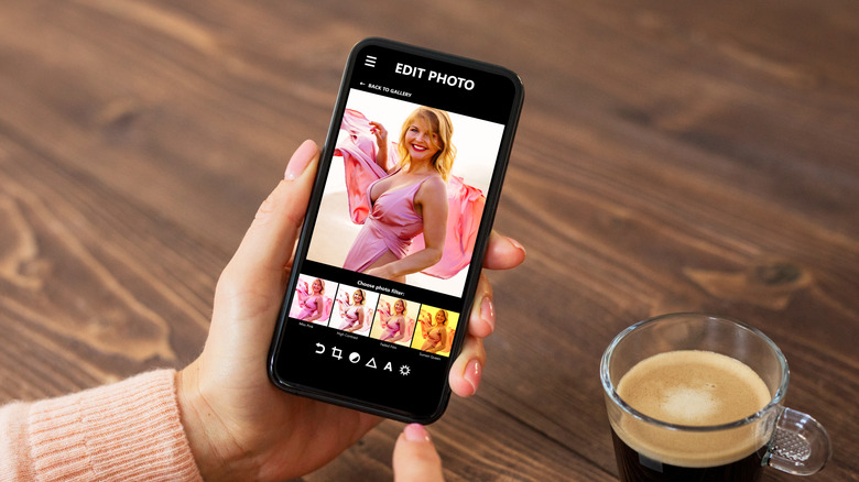 A person editing photos on their phone.