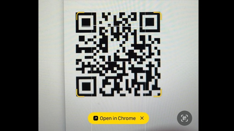 the iPhone Camera app reading a QR code.