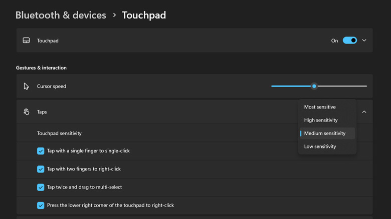 A screenshot of Windows 11 settings showing the Taps sub-menu open inside Touchpad in Bluetooth & devices. It shows a bar that you can use to change the cursor speed and a dropdown option to change touch sensitivity