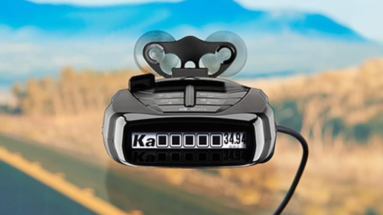 Cobra radar detector mounted on a windshield