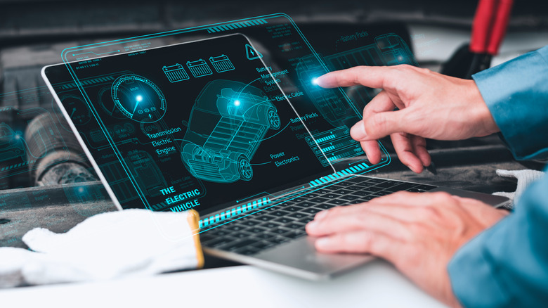 Analyzing car gadgets on laptop