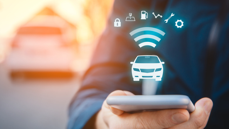 Person holding a smartphone with a hologram