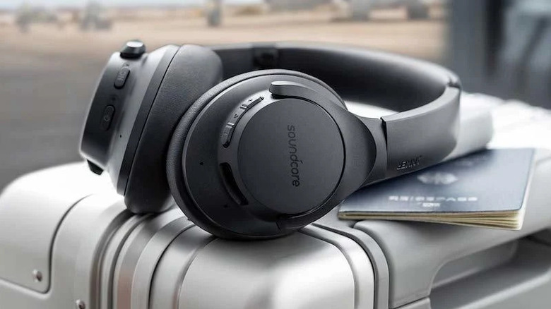 The Anker Soundcore Life Q20 headphones on top of a suitcase and passport