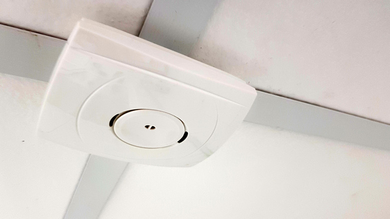 A ceiling-mounted glass break detector.