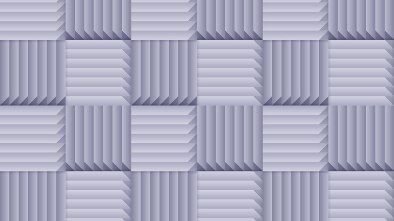 A grid of square acoustic foam panels arranged in alternating horizontal and vertical orientations.