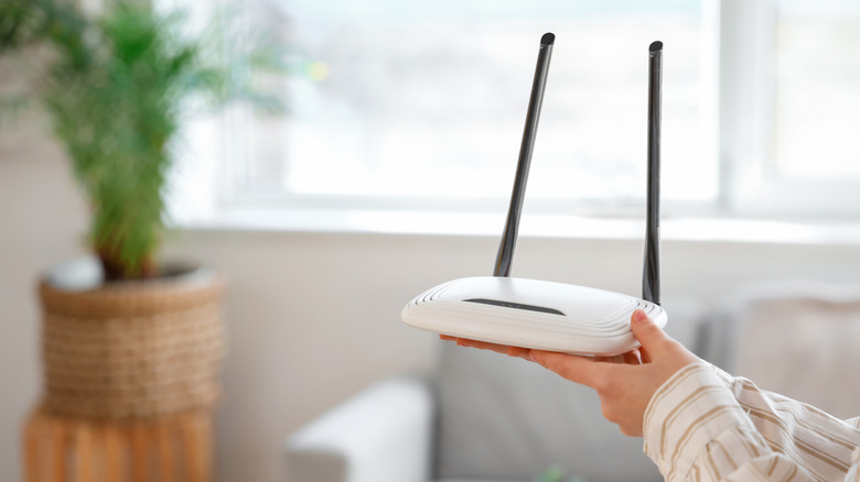 Someone holding a router