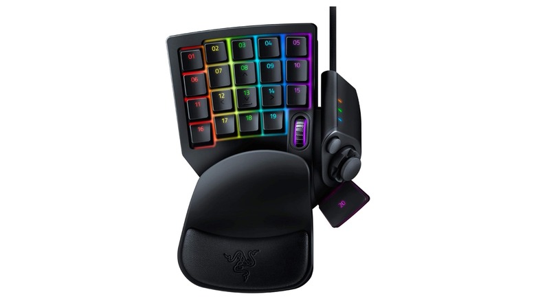 A compact gaming keypad with RGB-backlit programmable keys, wrist rest, scroll wheel, and side controls designed for gaming and streaming shortcuts.