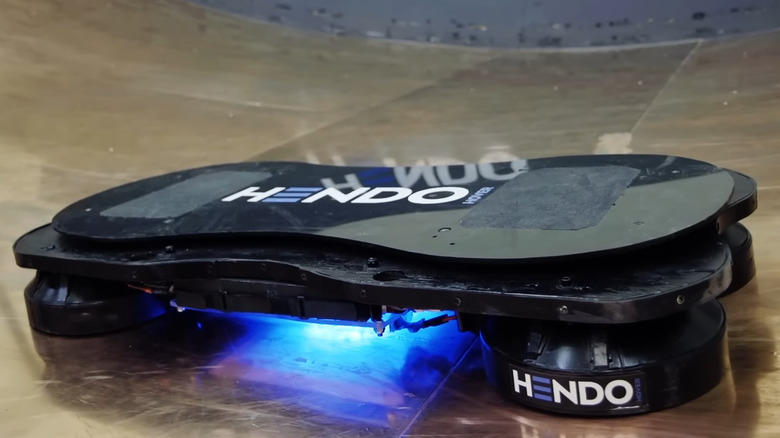 Hendo hoverboard levitating above conductive surface with blue glow underneath