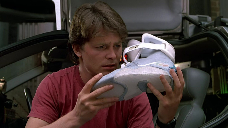 Marty McFly examining self-lacing Nike shoe in Back to the Future Part II (1989)