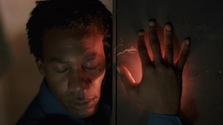 Screenshot from movie The Brother from Another Planet featuring close-up of main character