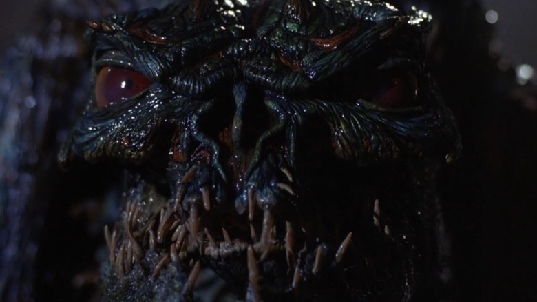 Screenshot from movie The Fly 2 featuring close-up of monstrous face