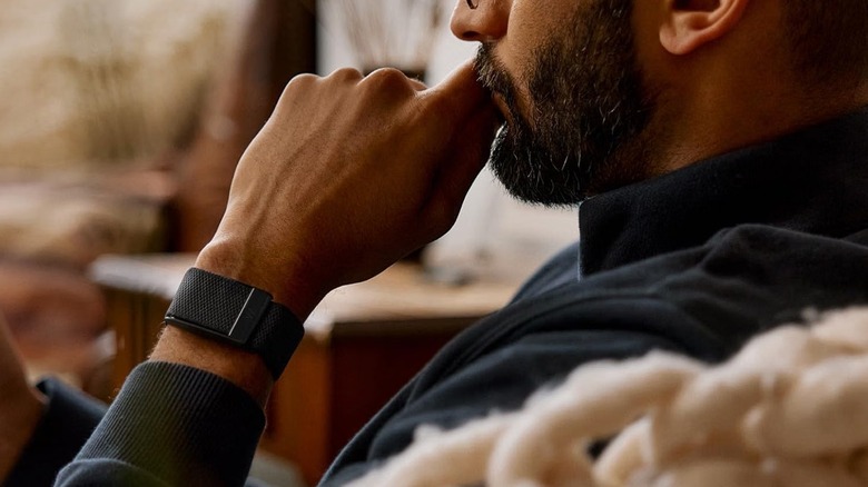 A person wearing the Whoop 5.0 activity tracker.