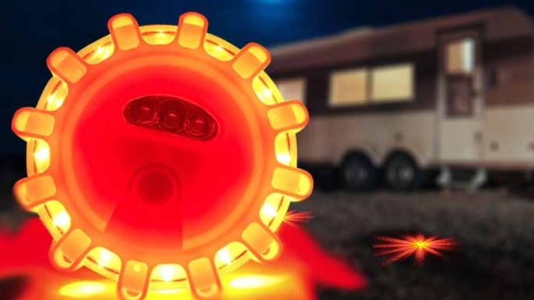 The Ecoangel LED road flares in the foreground, with an RV in the background.