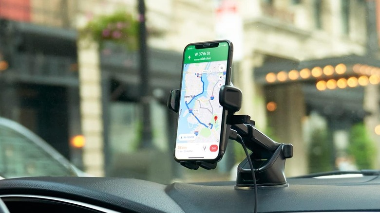 The iOttie Easy One Touch Wireless 2 charging phone mount installed on a car's dashboard.