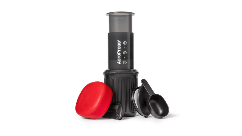 A woman making coffee in AeroPress Go and sipping it in the second part of the image