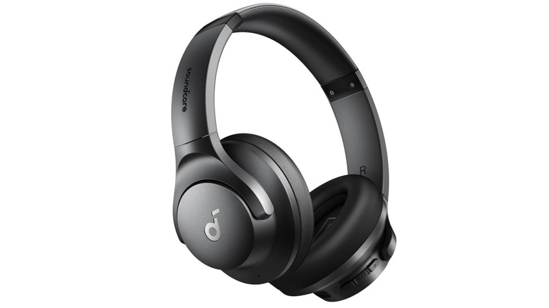 A woman wearing Soundcore Q20 from Anker with a mention of 60H battery life in blue text