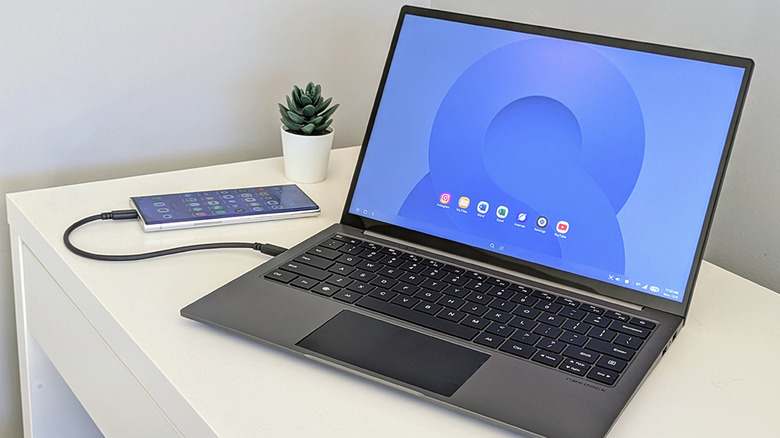 A Samsung phone plugged into a NexDock laptop shell.