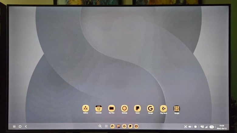 A smart TV displaying the Samsung DeX default desktop.