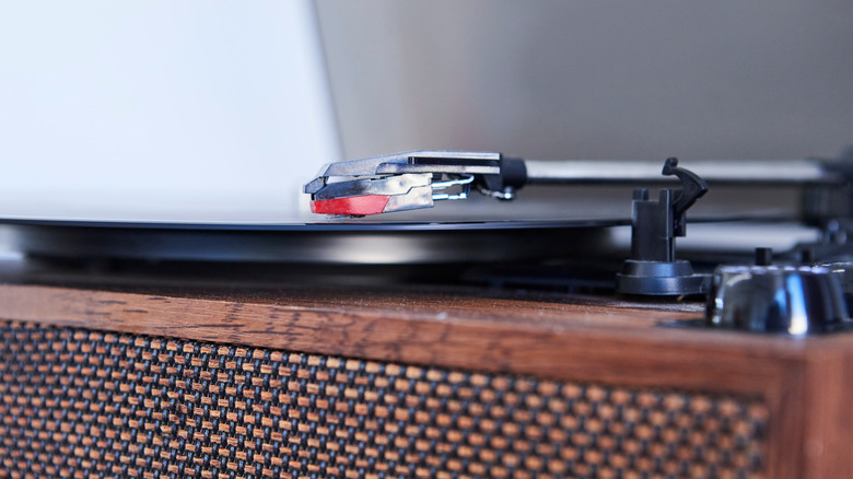 A classic record player, with the needle on vinyl