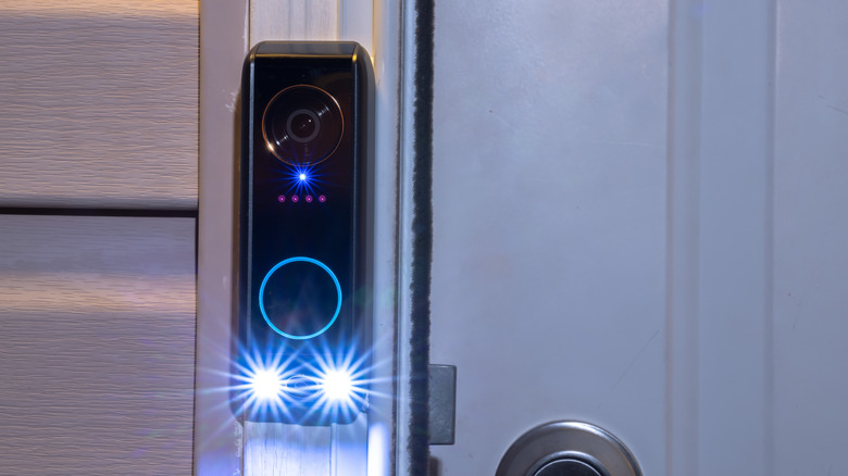 A close-up of a smart motion detection doorbell
