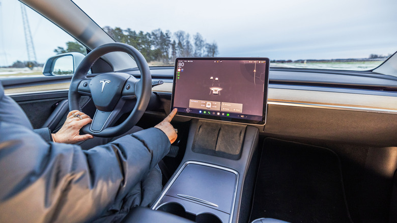Operating the touchscreen while driving the Tesla Model Y