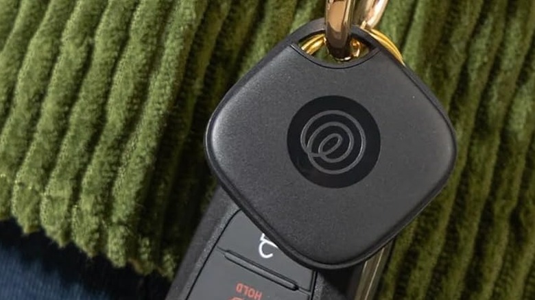 The Life360 Tile Mate Bluetooth tracker attached to a car key fob.