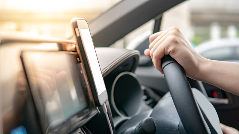 Phone Mount on a car dashboard being used by passenger