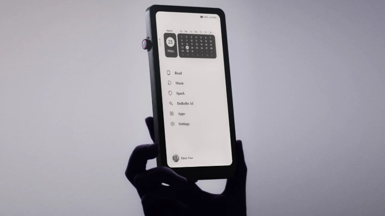 A silhoutte of a hand holding up the Durobo Krono, a pocket-friendly eReader.