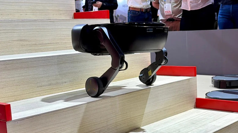 The Roborock Saros Rover climbing stairs with its wheeled legs