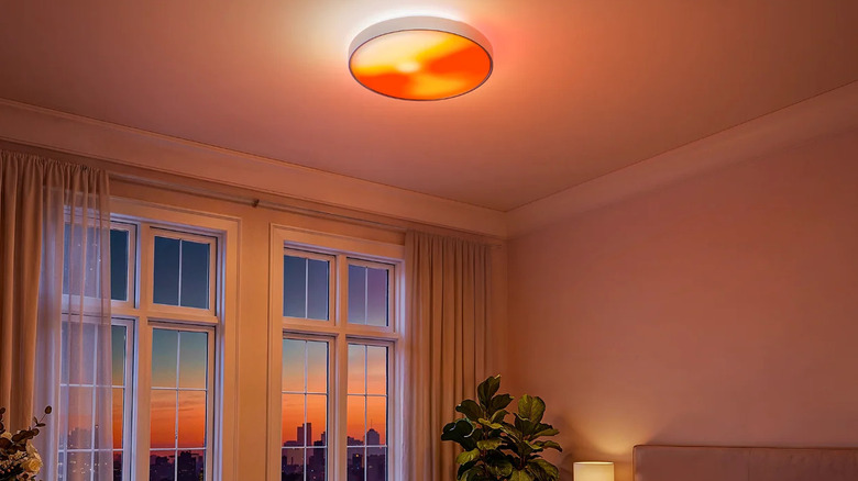 Govee Ceiling Light Ultra with a sunset scene in a modern cozy living room.