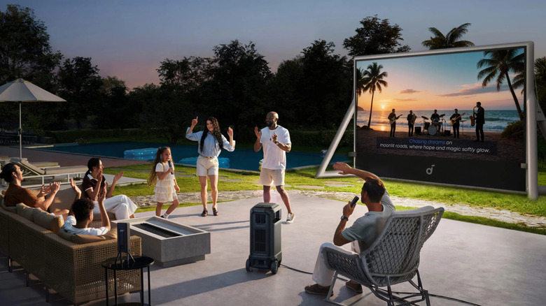Outdoors family karaoke party with the Soundcore Nebula X1 Pro and inflatable screen.