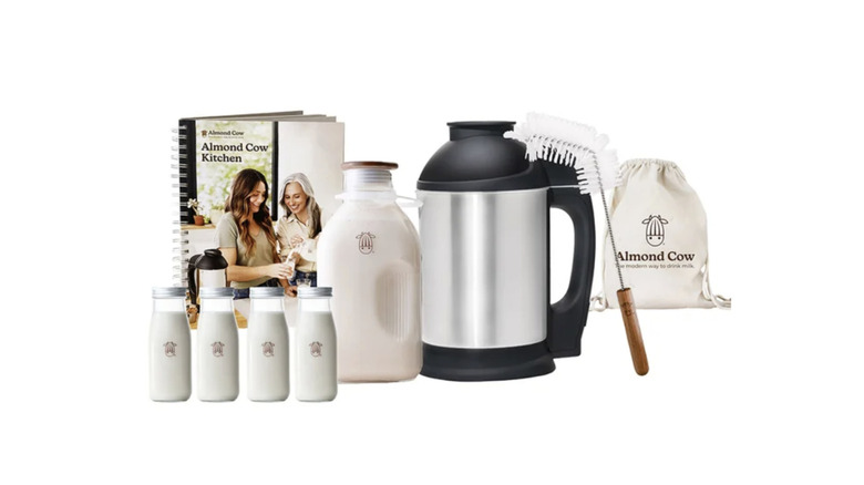 Almond Cow plant-based milk maker whole setup with accessories and manual.