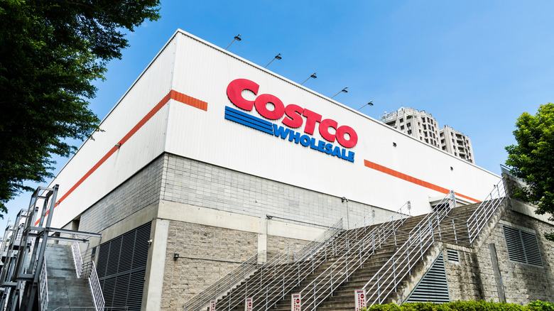 Costco Wholesale store exterior with large red and blue logo on building facade.