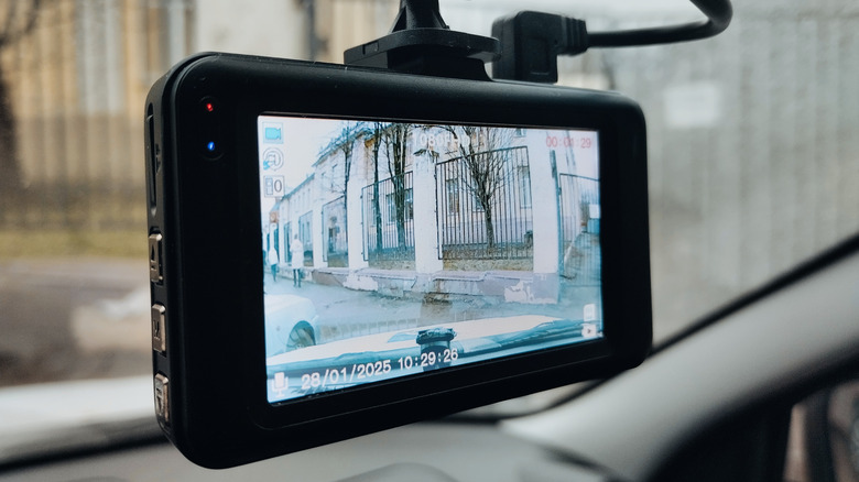 A dash cam on a windshield