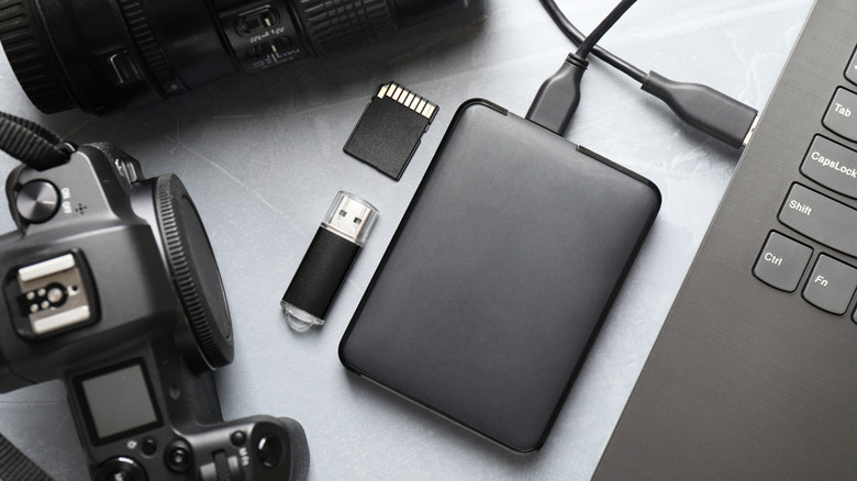 An external hard drive is connected to a laptop.