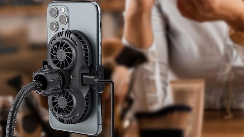 The Neveika plug-in phone cooler attached to a phone.