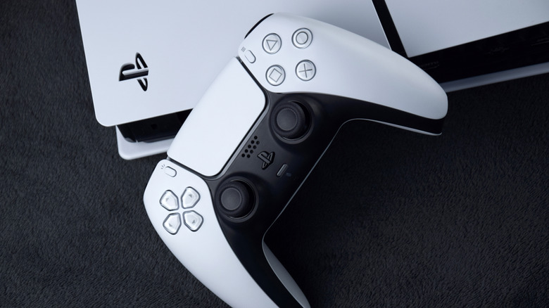 A PS5 and controller on a table