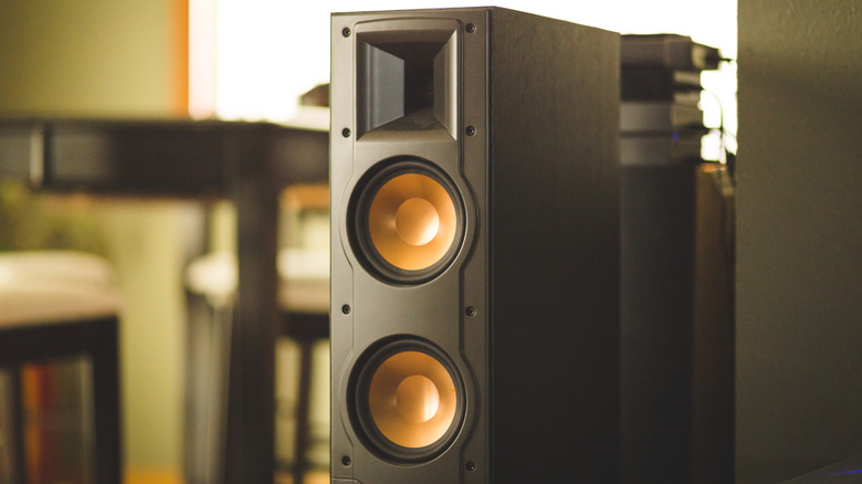 Home theater speaker near a wall in a living rooom