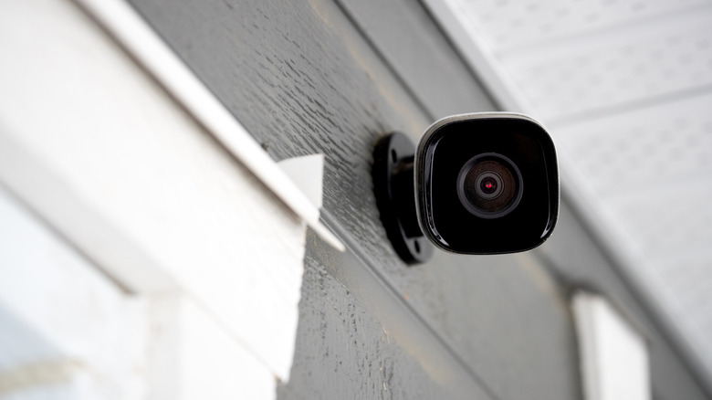 A security camera looks down at the viewer.