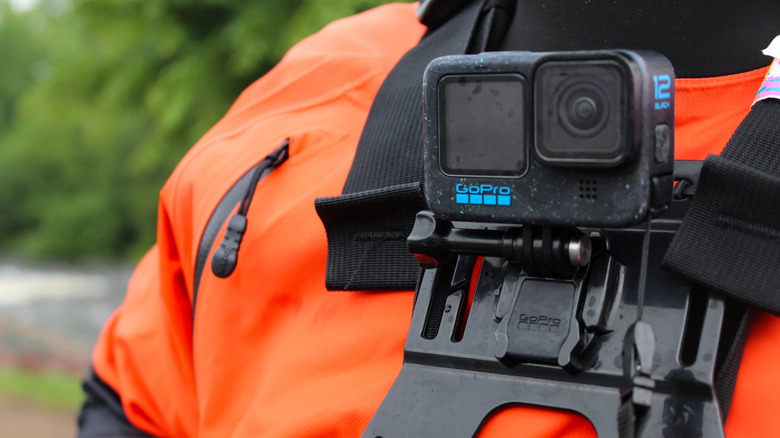 A GoPro camera is mounted on a person's chest.