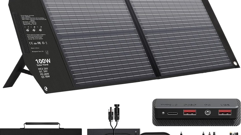 Mesuvida 100W solar panel unfolded on a plain white background, showing close up of the USB charging ports