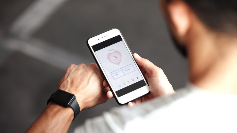 A person looking at health data on their phone.