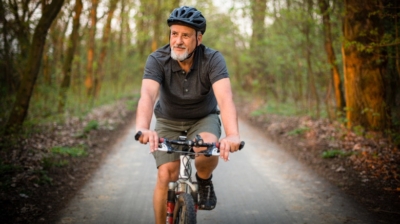 A man riding a bike for outdoor exercise.