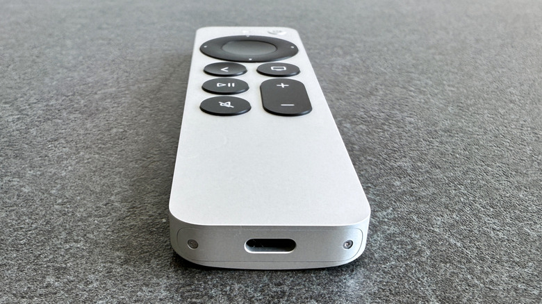 An Apple TV remote with the USB-C port visible.