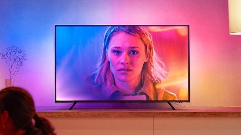 A TV with the Philips Hue Play Gradient smart TV light strip installed at the back.