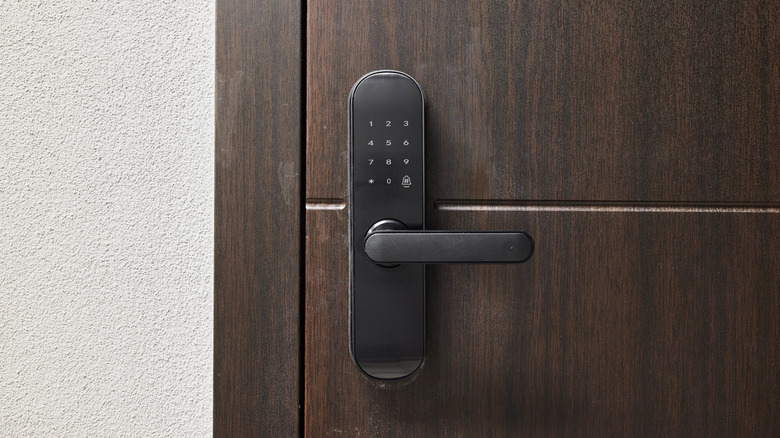 A smart lock installed on a door.