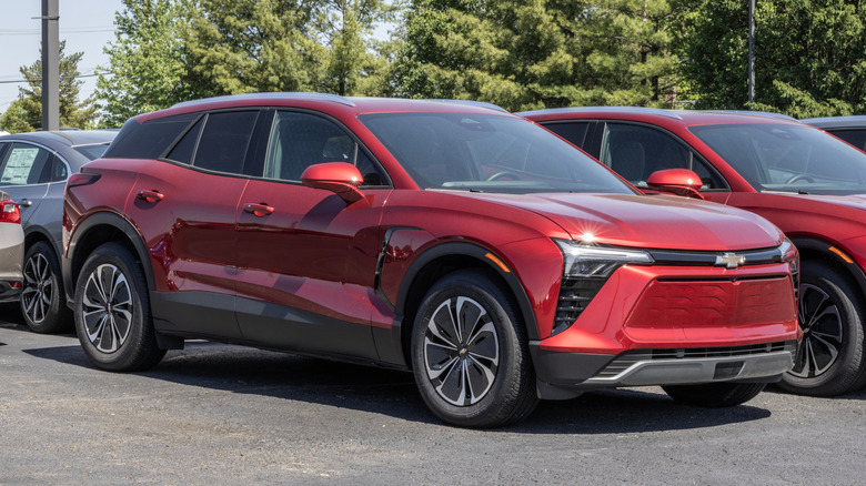A red 2024 Chevrolet Blazer EV parked alongside another Blazer.
